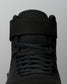Close-up of the RUDIS Samurai Speed Youth Wabi-Sabi wrestling shoe, showing black laces, textured mesh tongue, and wide ankle strap with stitched detailing.