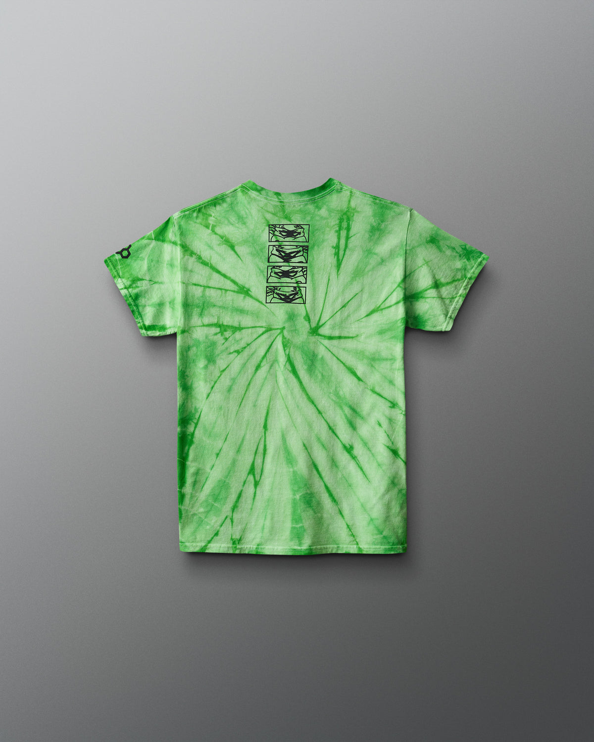 Green tie-dye t-shirt with a graphic on the chest against a gray background. TMNT. Teenage Mutant Ninja Turtles