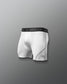 White athletic boxers with black waistband featuring 'RUDIS' brand on a gray background