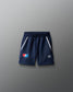 Navy blue shorts with white stripes on a gray background