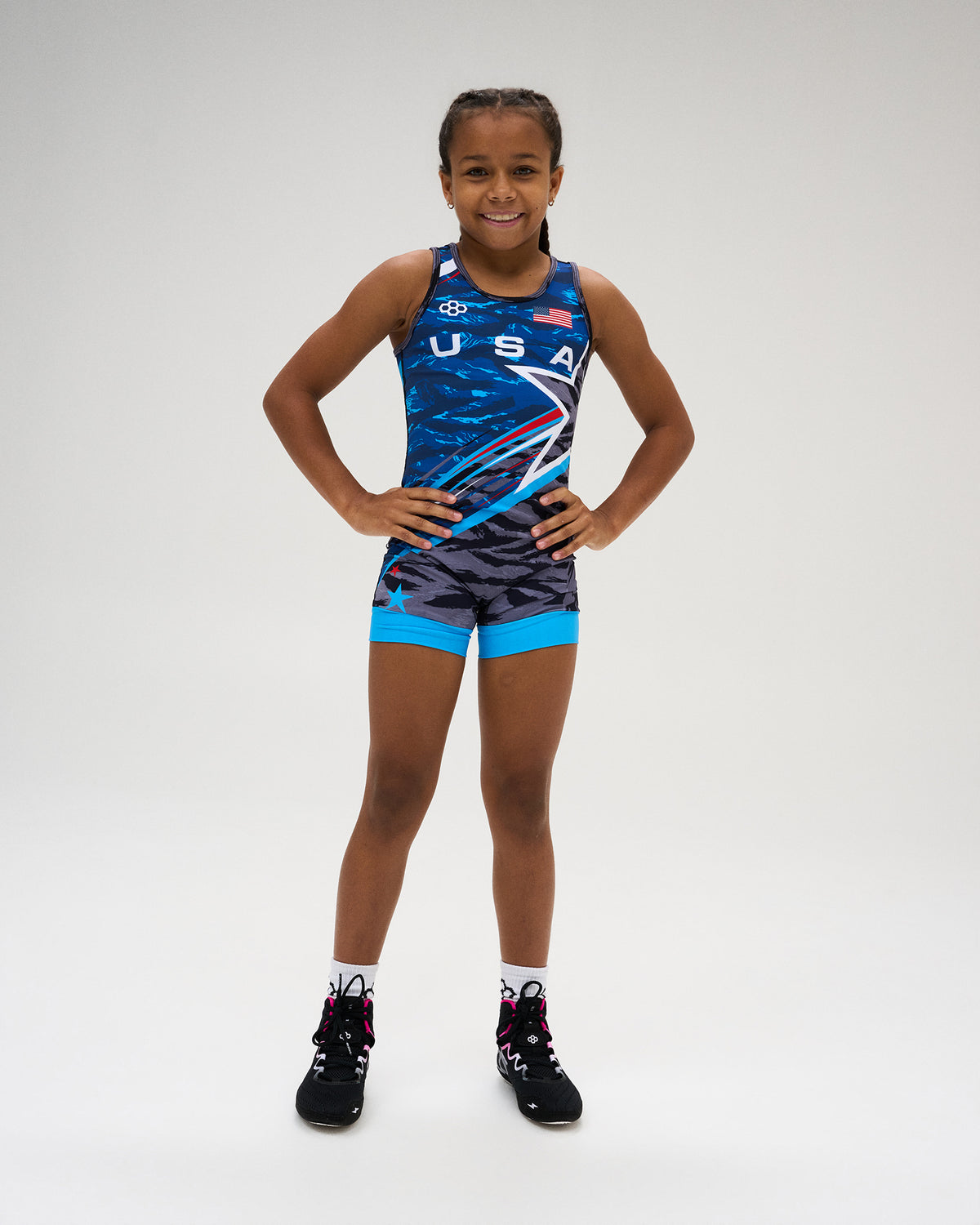 USA Wrestling Shooting Star Girls’ Elite 2.0 Singlet in blue, featuring USA graphics, American flag detail, RUDIS branding, and a competition-ready athletic fit.