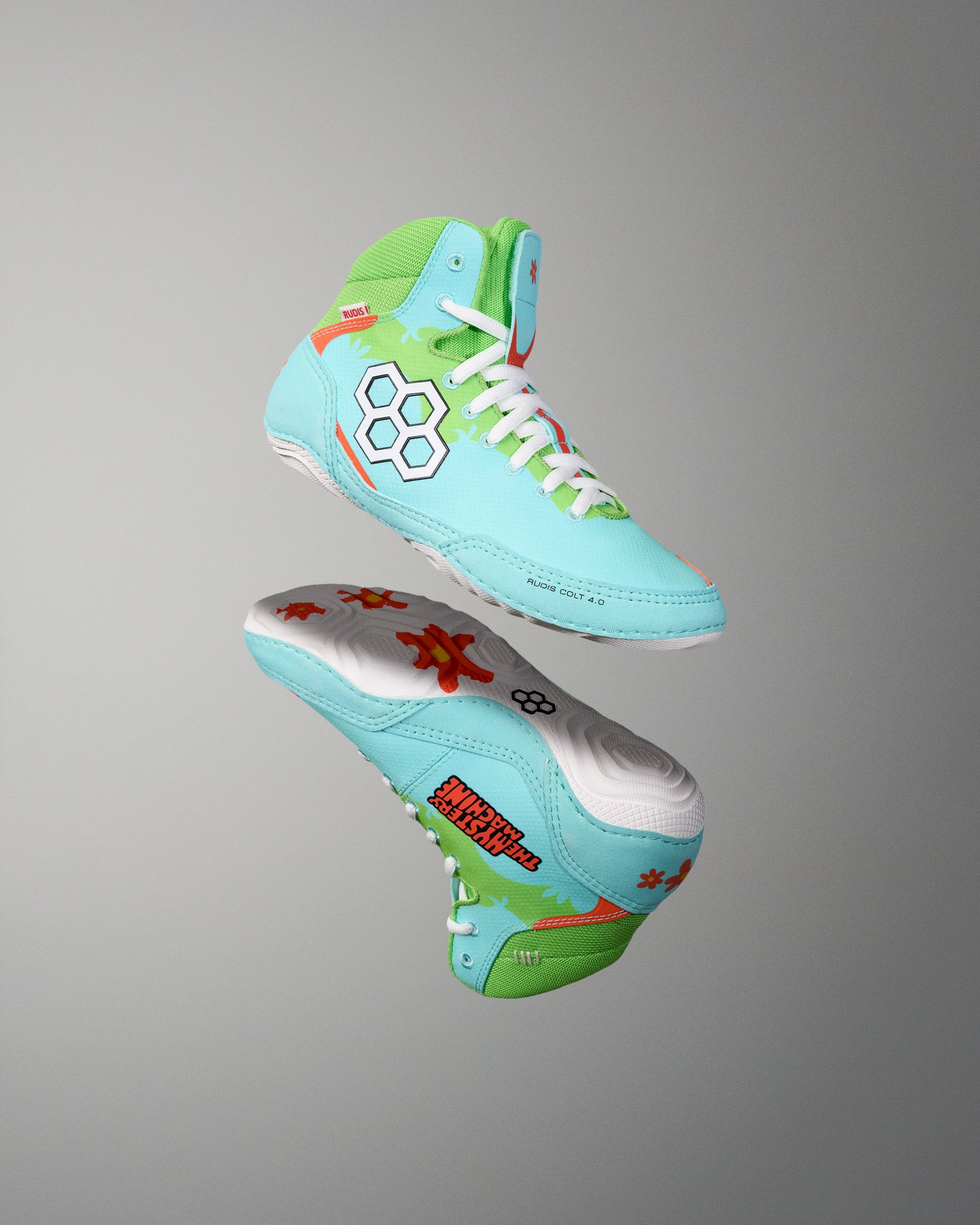 RUDIS Scooby-Doo Colt 4.0 youth wrestling shoes shown in angled side and outsole views, featuring turquoise and green uppers, white soles, and orange floral details.