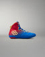 Outer side view of RUDIS Wonder Woman Hildebrandt 2.0 girls' wrestling shoe with a red-to-blue gradient upper, gold RUDIS logo, blue laces and gold trim.