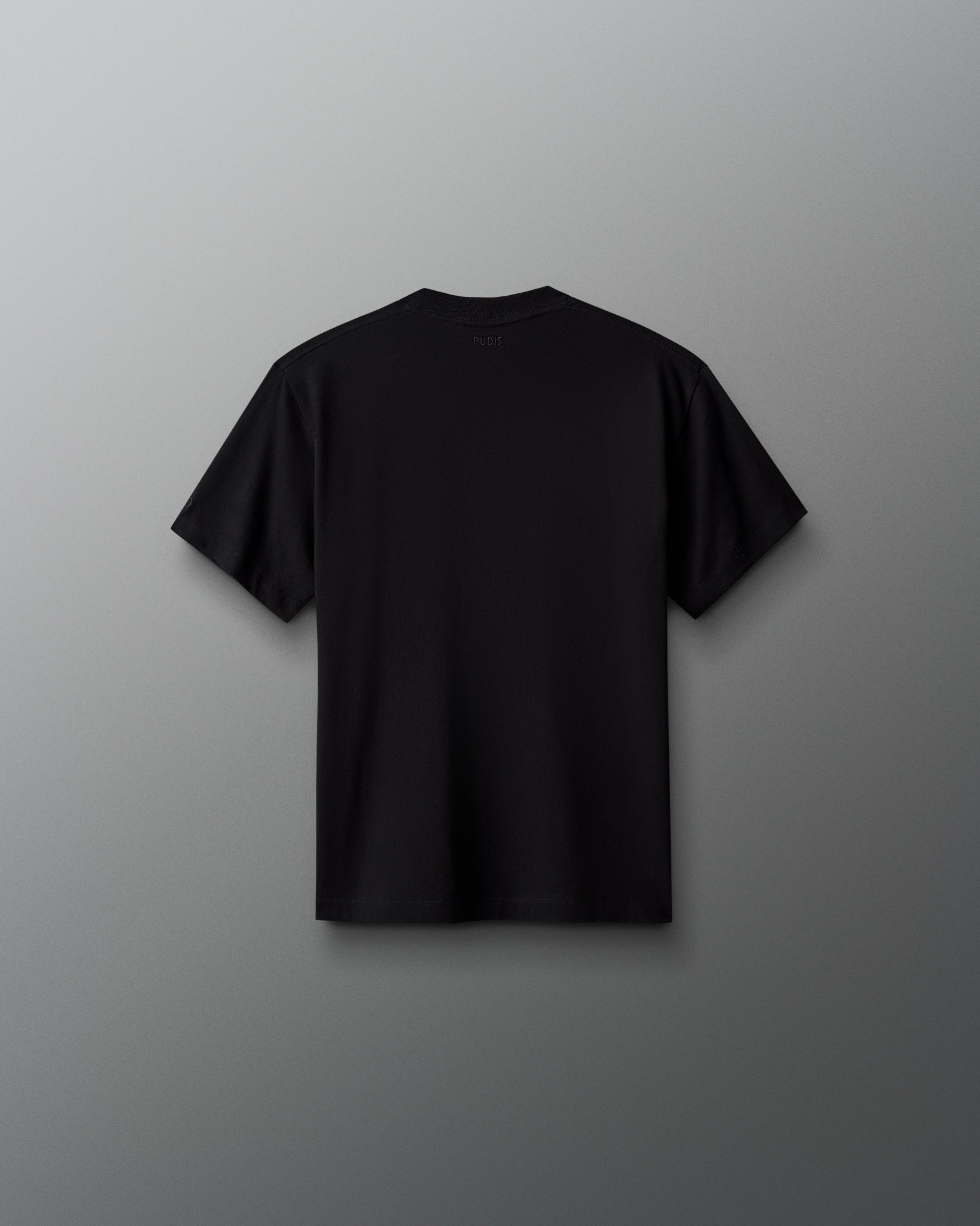 Back view of the RUDIS Scooby-Doo Youth Relaxed Cotton T-Shirt in black, featuring a solid black design, short sleeves, crew neckline, and subtle RUDIS branding below the back collar.